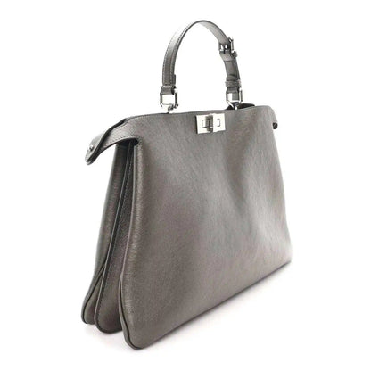 Fendi Peekaboo leather tote in tortora, side view with top handles and turn-lock clasp