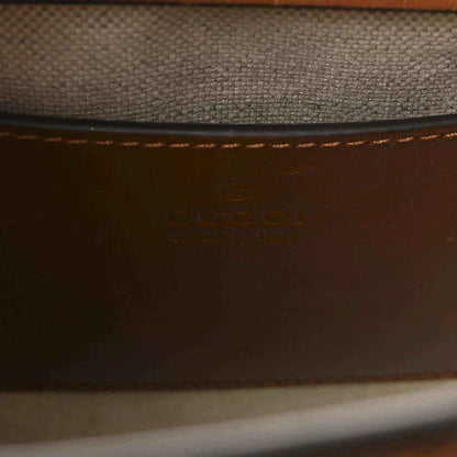 Gucci mini tote bag interior, brown leather with embossed logo stamp