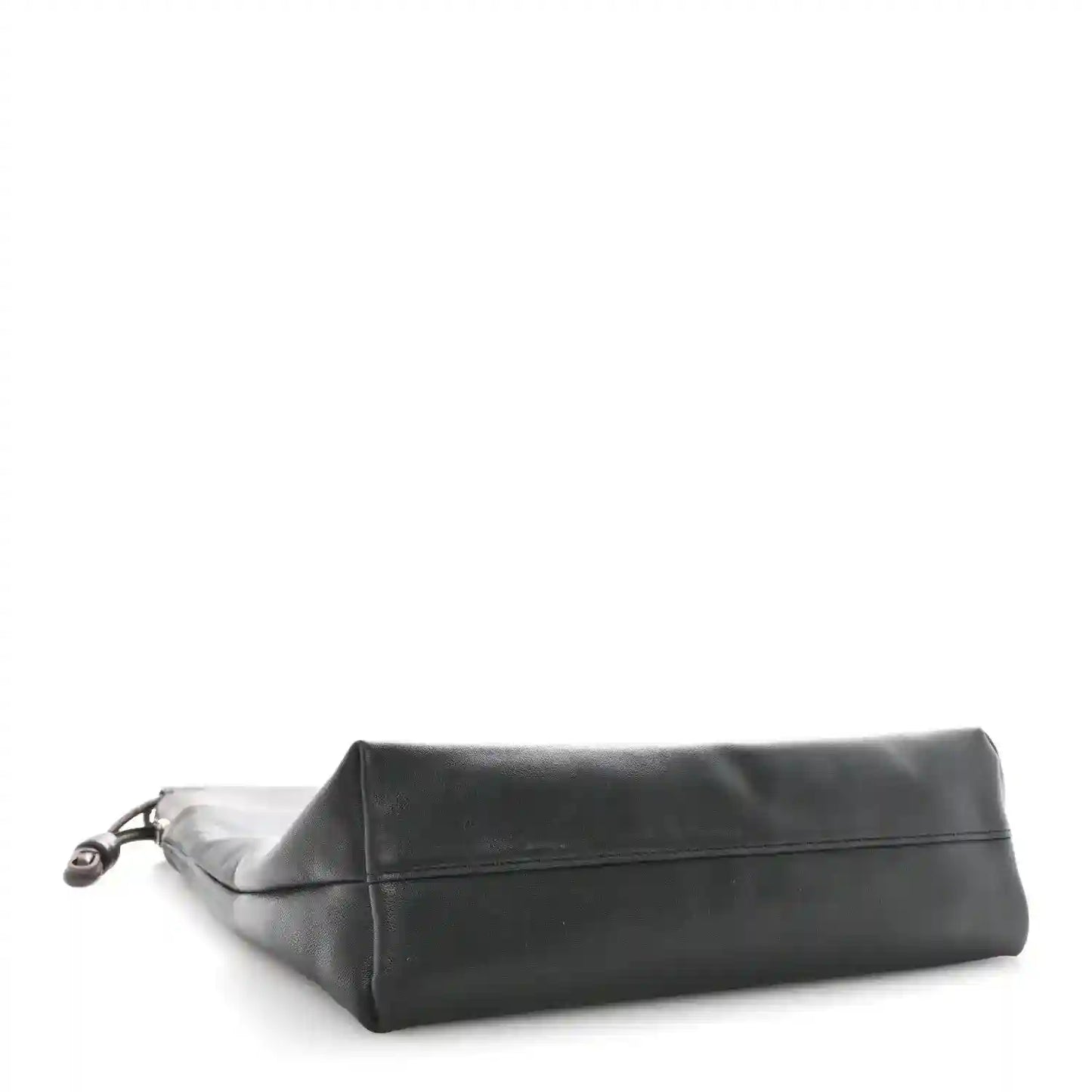Black leather tote bag shown from the side with a flat folded top edge.
