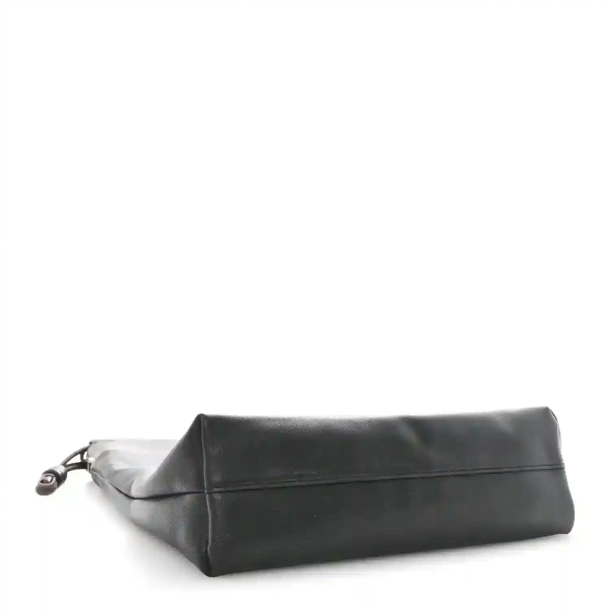 Black leather tote bag shown from the side with a flat folded top edge.