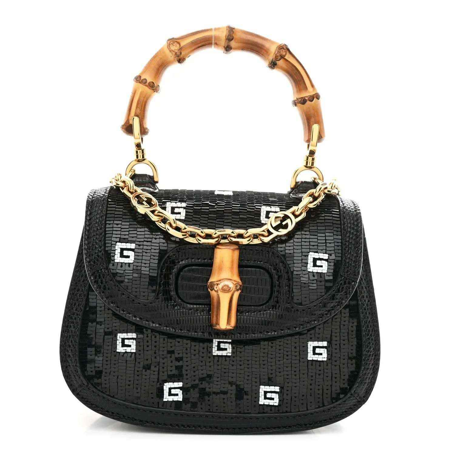 Black mini shoulder bag with bamboo top handle, gold chain strap, and embossed logo pattern