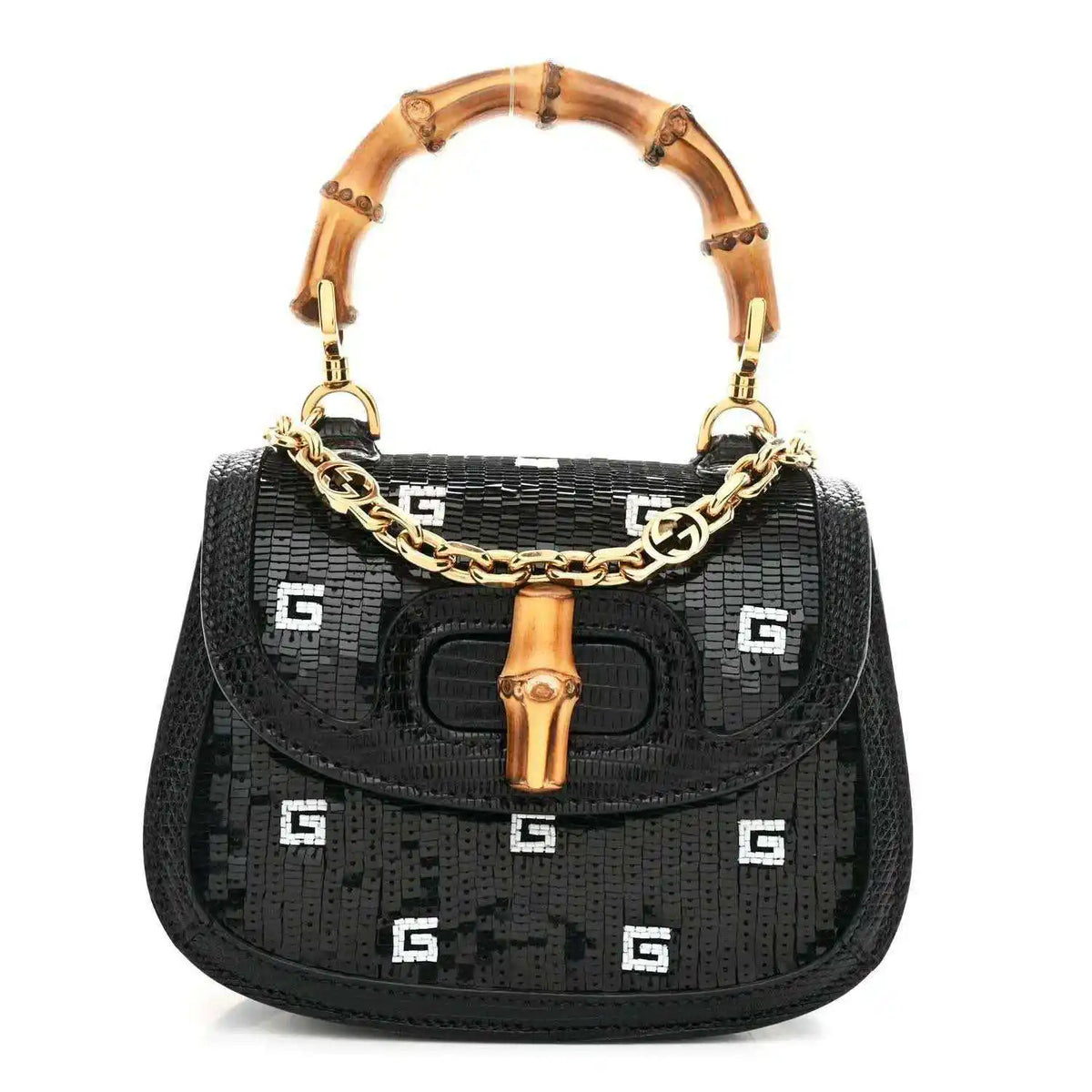 Black mini shoulder bag with bamboo top handle, gold chain strap, and embossed logo pattern