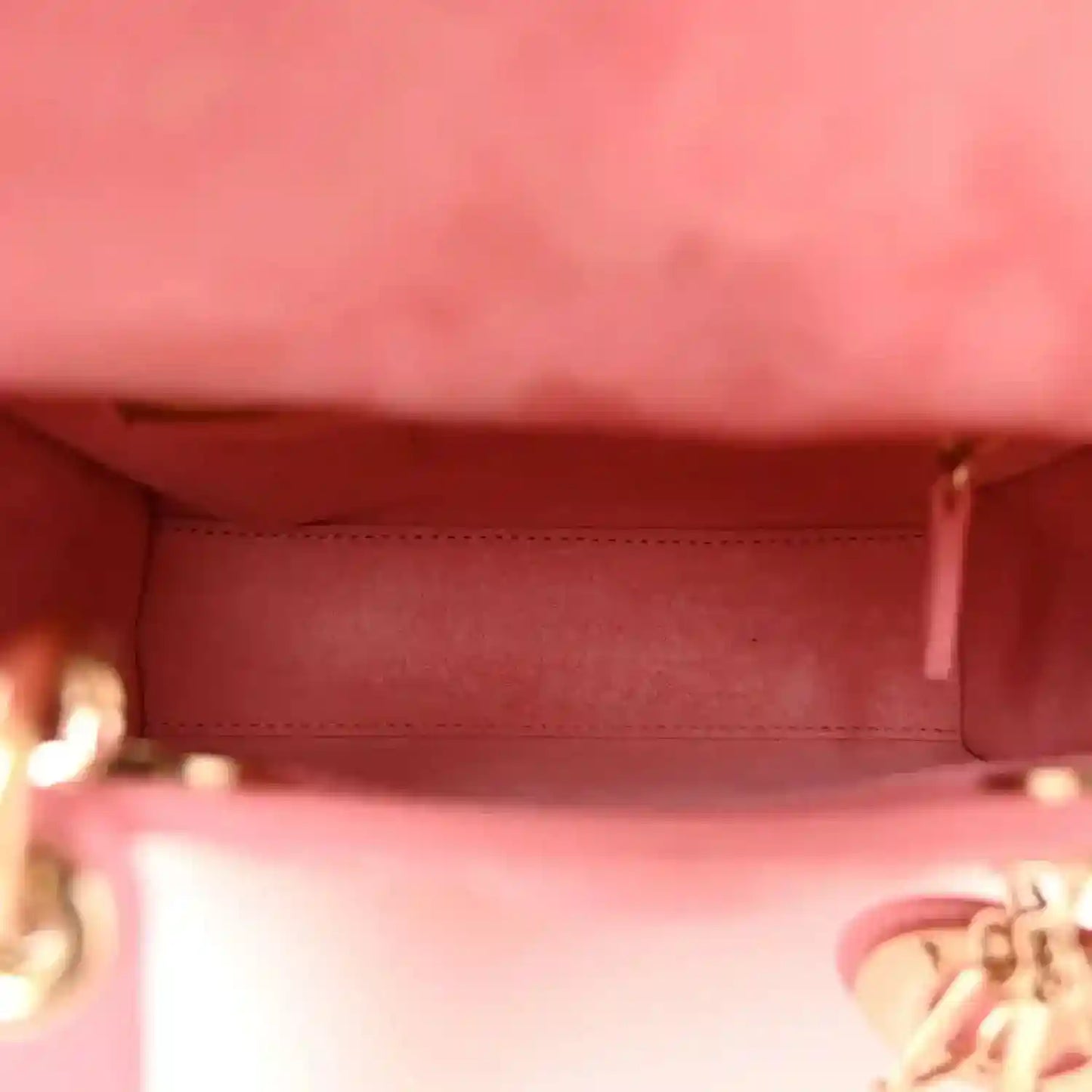Light pink handbag interior lining with stitched edge and side pocket