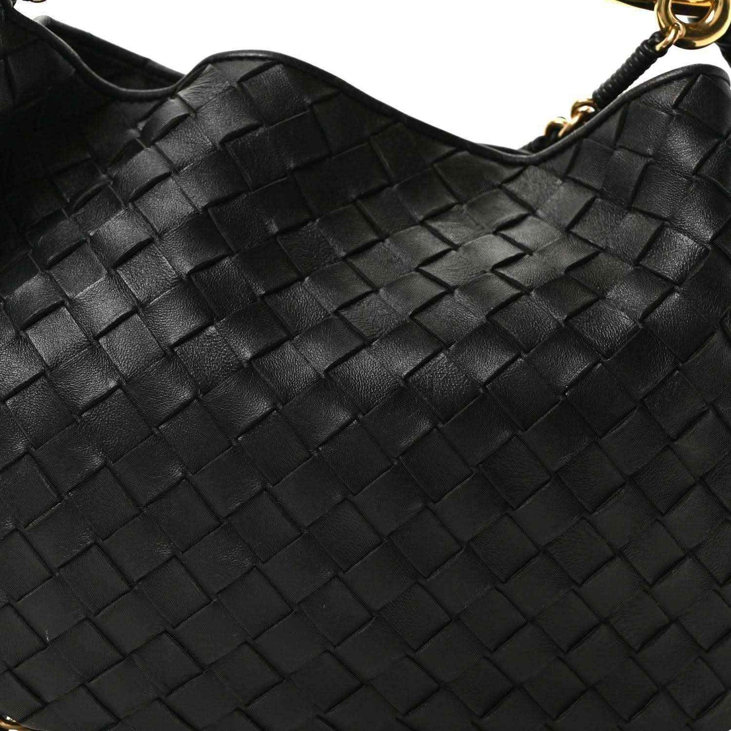 Bottega Veneta intrecciato nappa bag front, black woven pattern with gold ring hardware.
