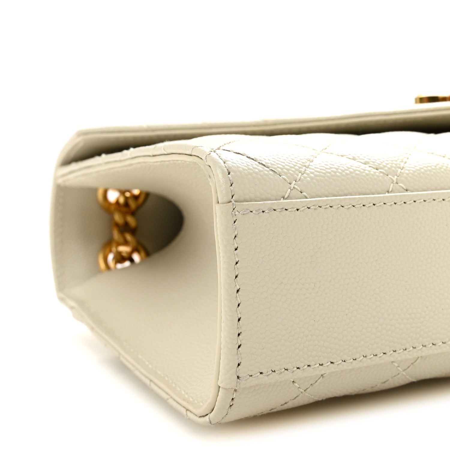 Cream quilted satchel corner with gold chain connector and side opening