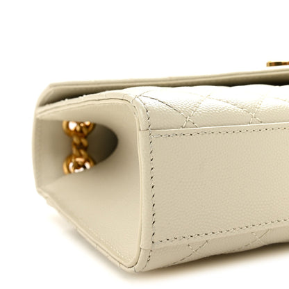 Cream quilted satchel corner with gold chain connector and side opening