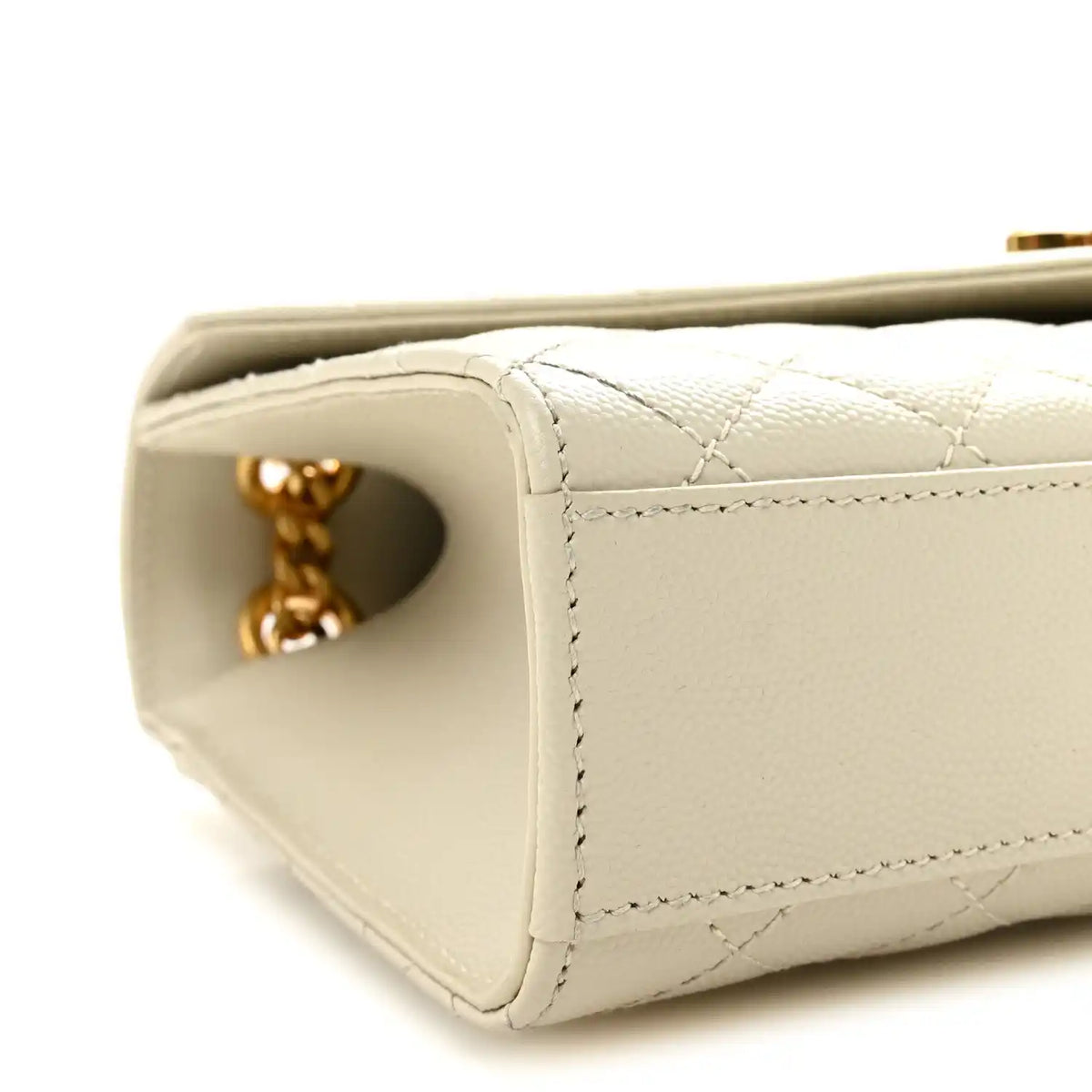 Cream quilted satchel corner with gold chain connector and side opening