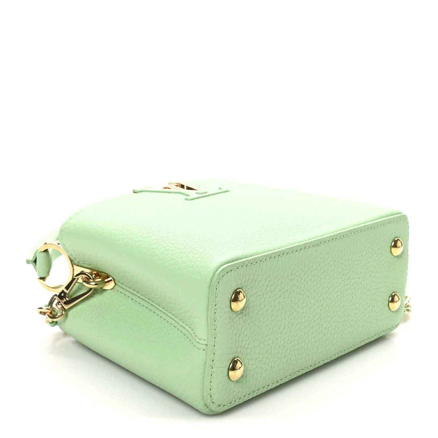 Green leather mini handbag with gold-toned feet on base