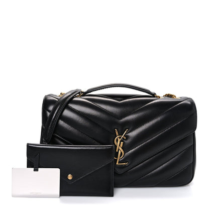 Black quilted shoulder bag with YSL clasp and chevron quilting, shown front view