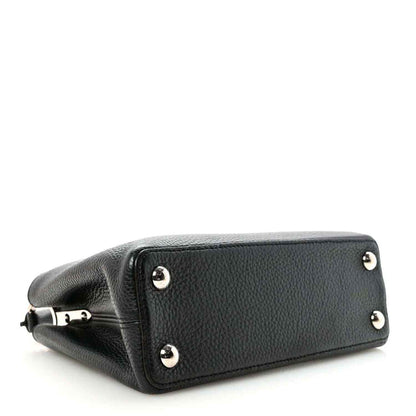 Louis Vuitton Capucines BB black leather handbag with silver feet and studs