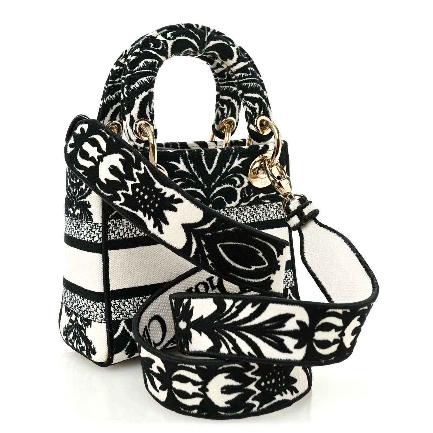 Mini embroidered canvas bag with floral-and-bar pattern, gold-tone hardware and handles