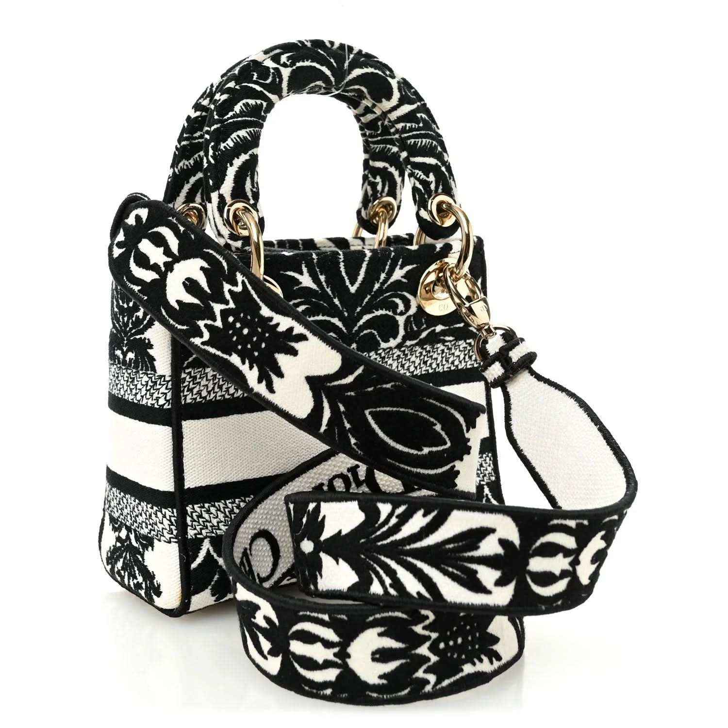Mini embroidered canvas bag with floral-and-bar pattern, gold-tone hardware and handles