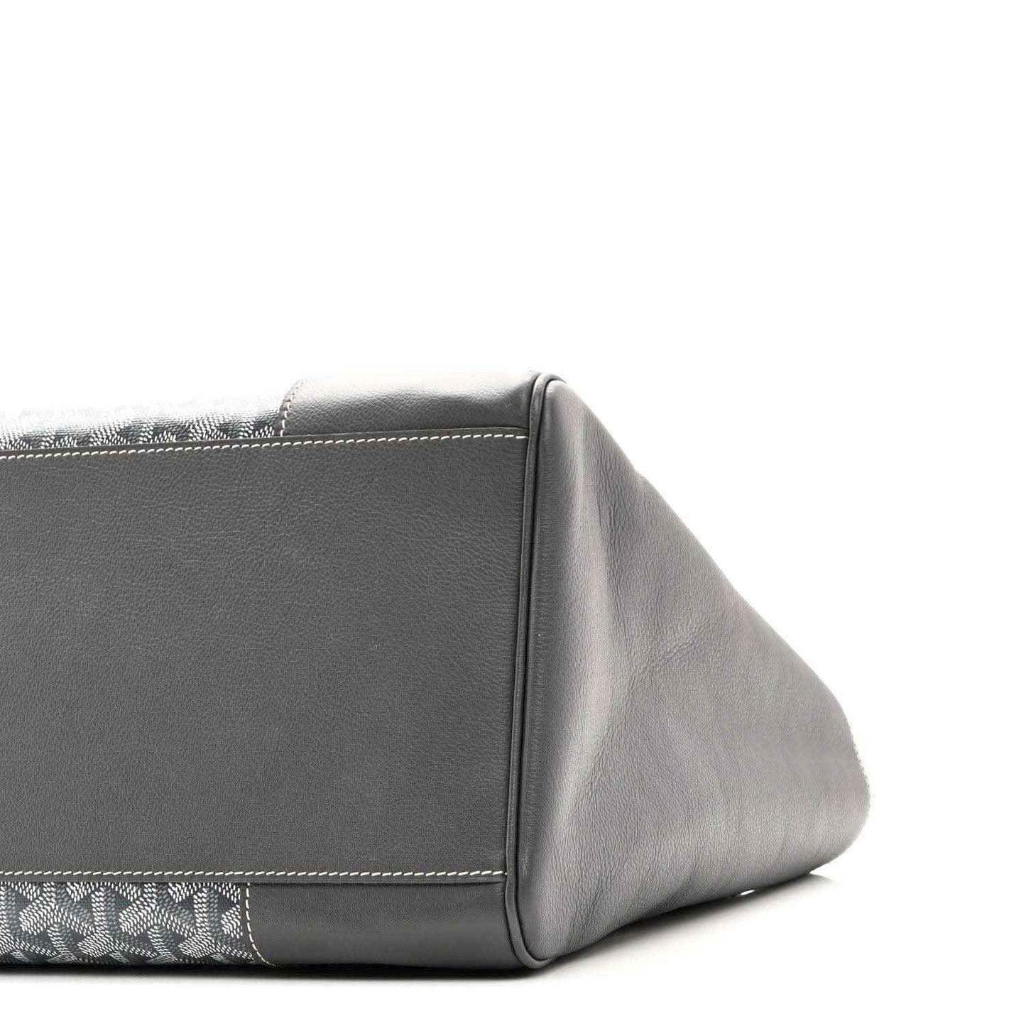 Grey tote corner and side profile with leather panel and stitched detailing, patterned trim