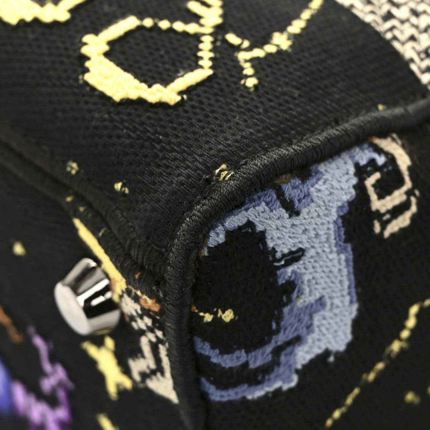 Black canvas bag strap with blue zodiac embroidery and gold stitched trim
