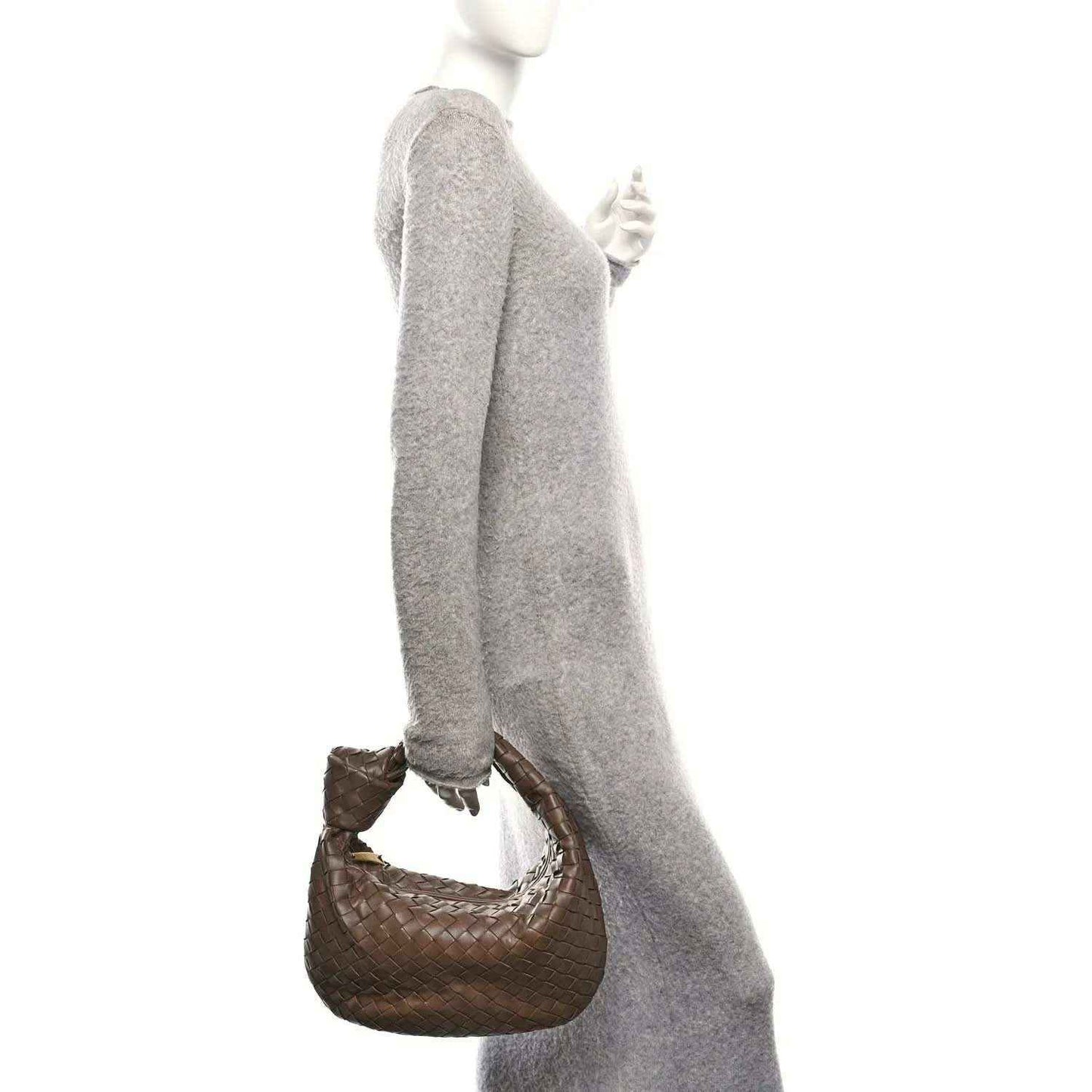 Taupe woven leather teen hobo bag with short handle, shown being carried