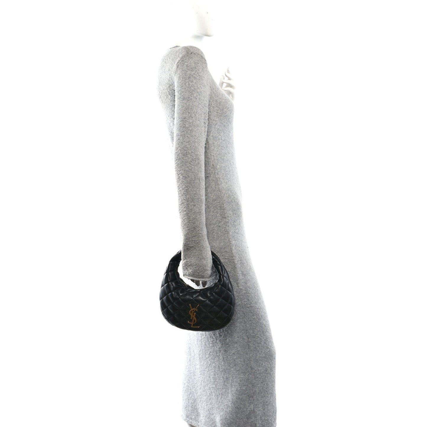 Black mini pouch charm attached near the top handle of the bag