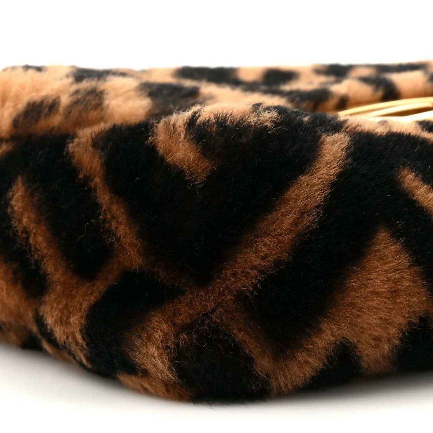 Shearling FF logo pattern on mini baguette bag, tobacco brown and dark black close-up.