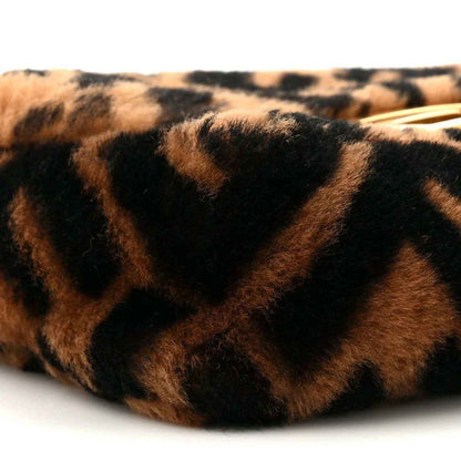 Shearling FF logo pattern on mini baguette bag, tobacco brown and dark black close-up.