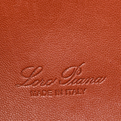 Embossed Loro Piana logo on grained calfskin pouch in brown