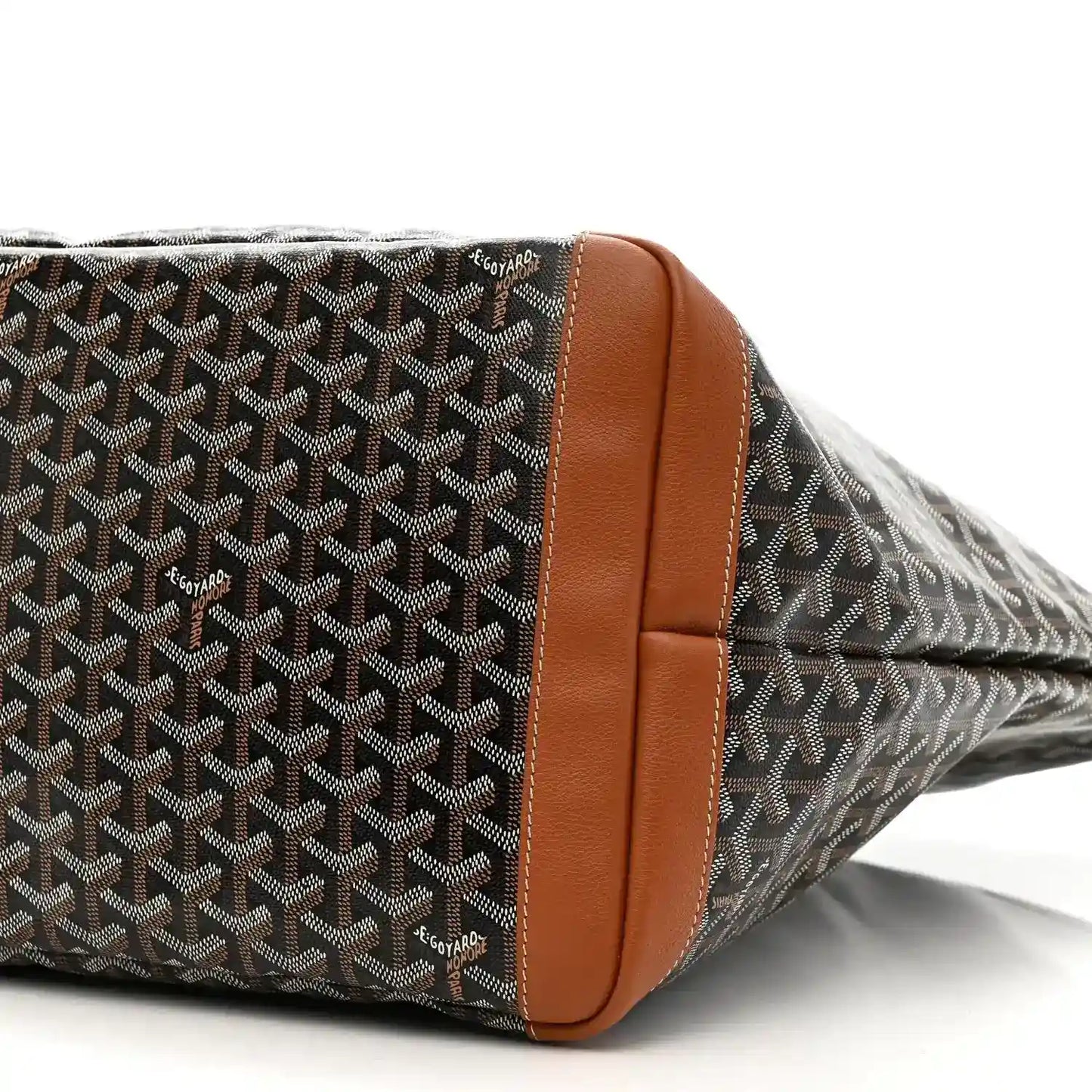 Goyard Artois GM tote bag corner close-up, black Goyardine canvas with tan leather edging