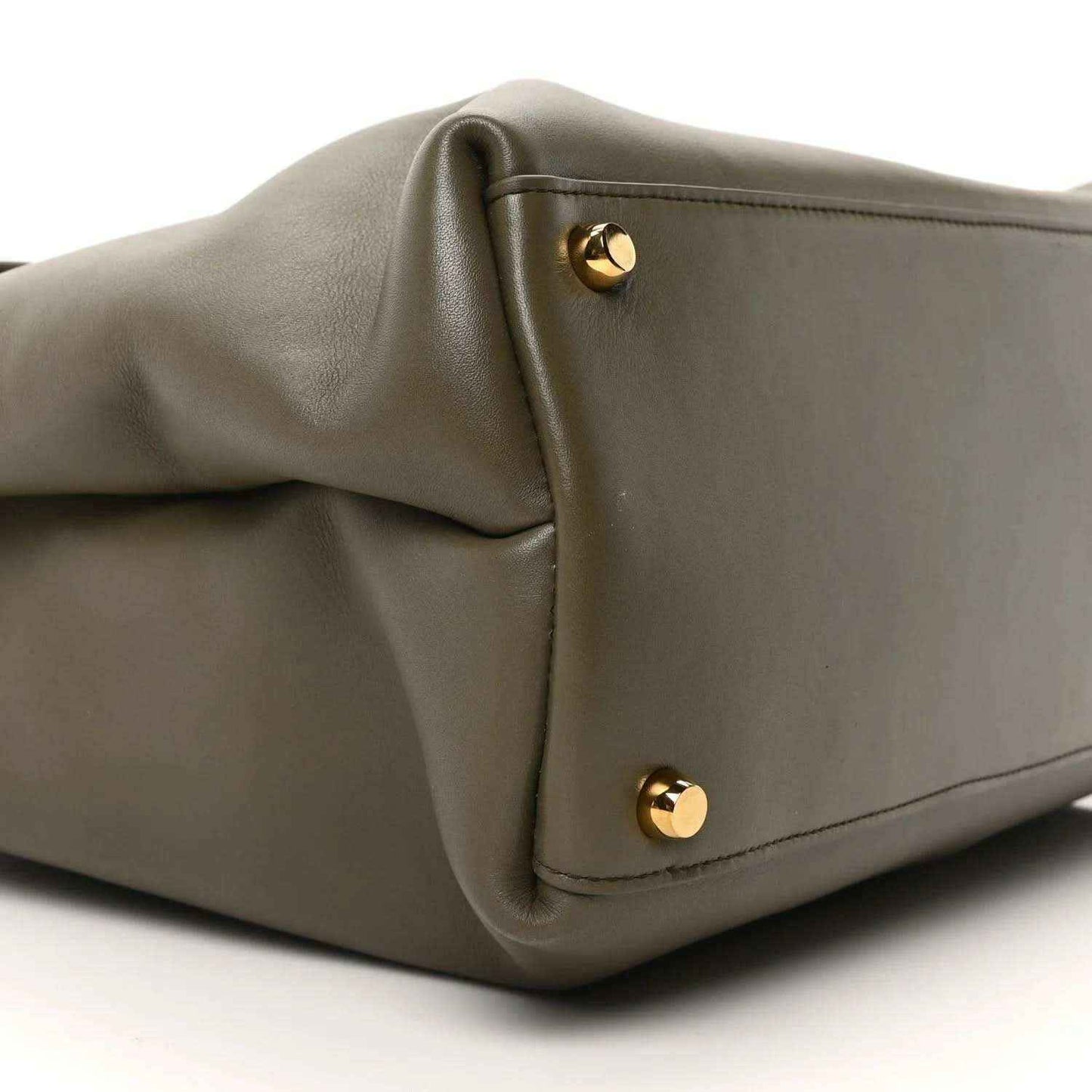 Cypress calfskin handbag corner with two gold snap buttons