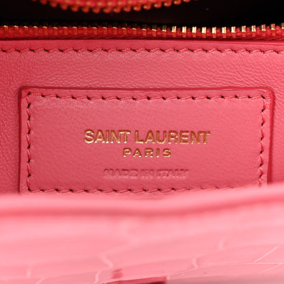Pink leather bag label inside lining with “SAINT LAURENT PARIS” stitching