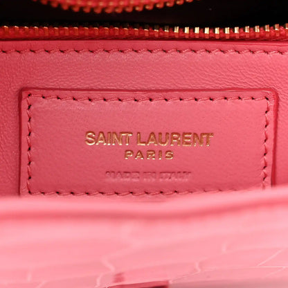Pink leather bag label inside lining with “SAINT LAURENT PARIS” stitching