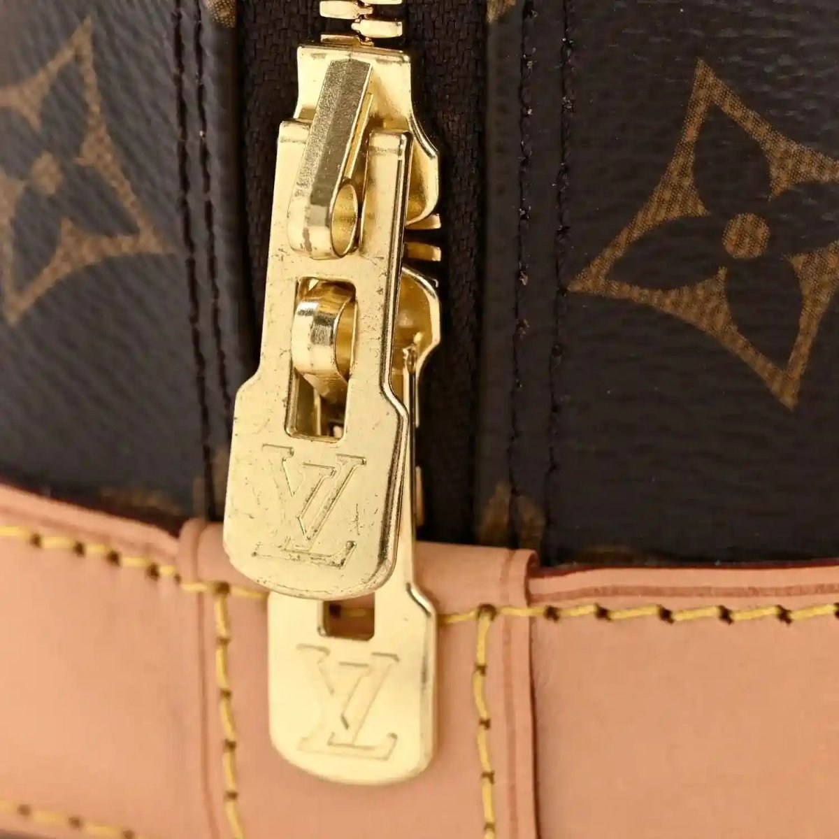 Louis Vuitton monogram Alma BB small tote bag with gold clasp and leather strap