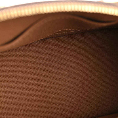 Monogram tote bag interior fabric close-up in dark brown
