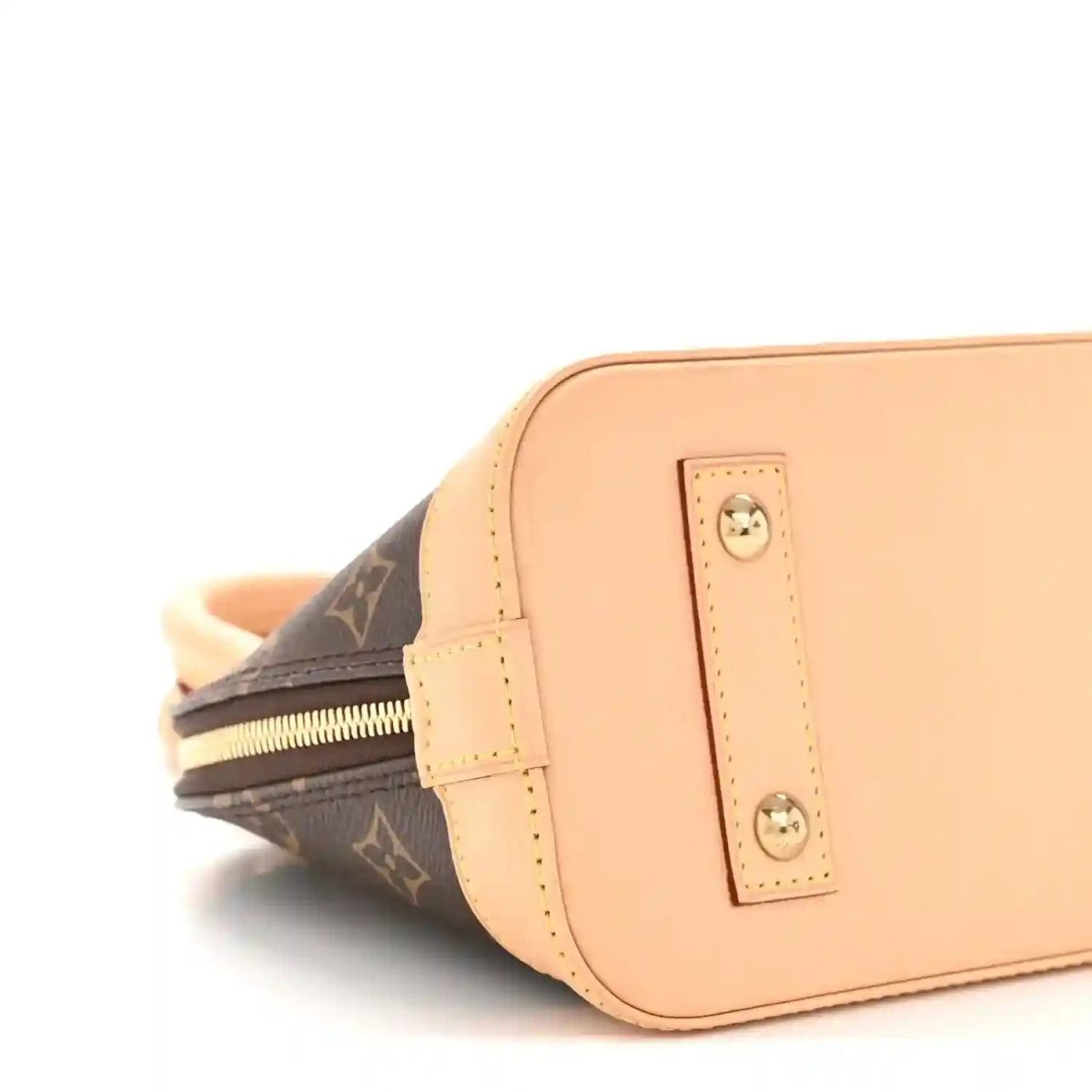 Monogram tote bag side close-up with tan leather front pocket and zipper track