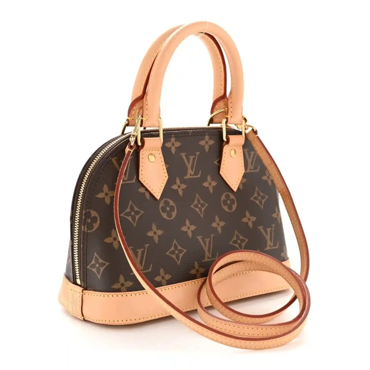 Small monogram tote bag with tan leather handles, front strap, and top zipper