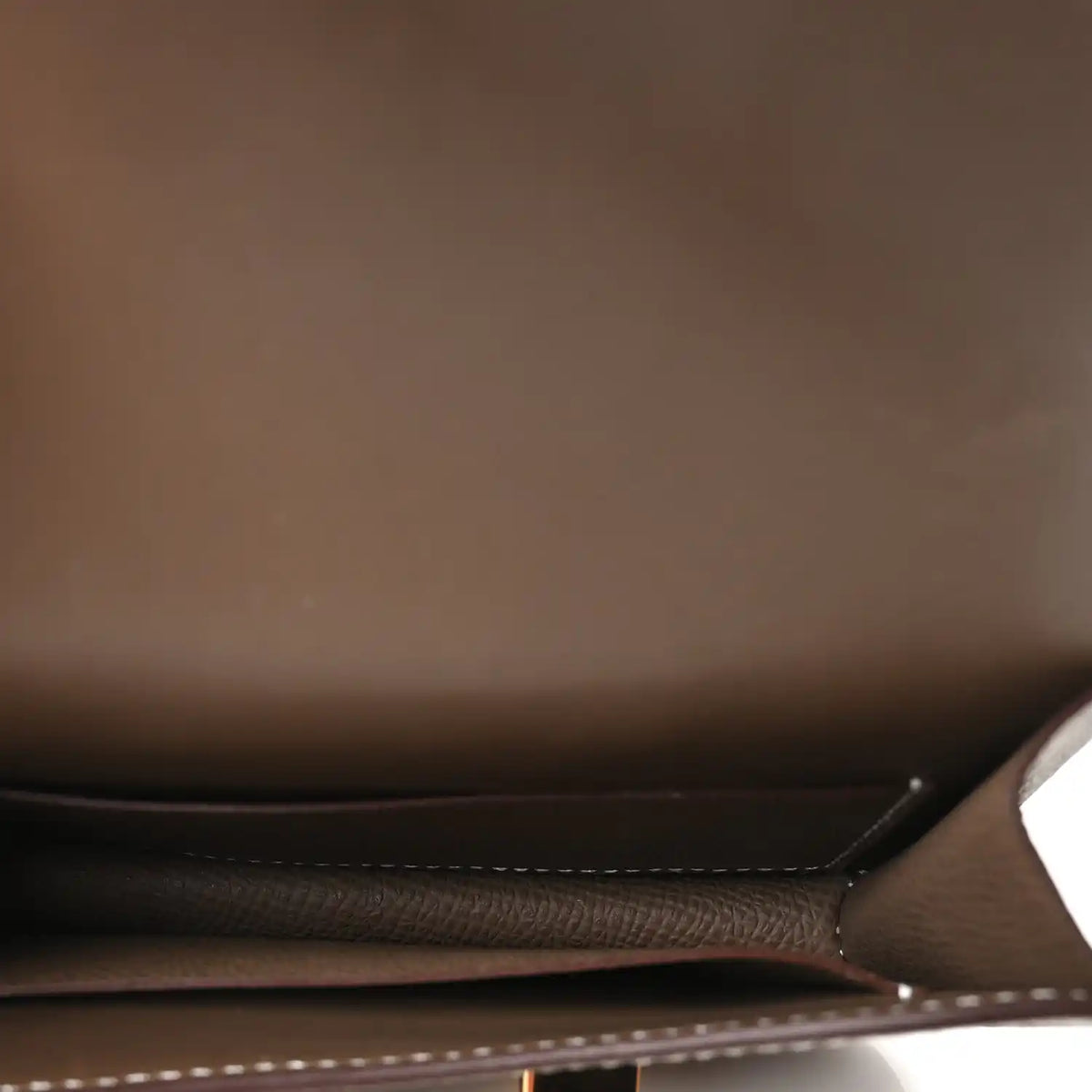 Hermes Constance slim wallet interior, dark lining and stitched seams