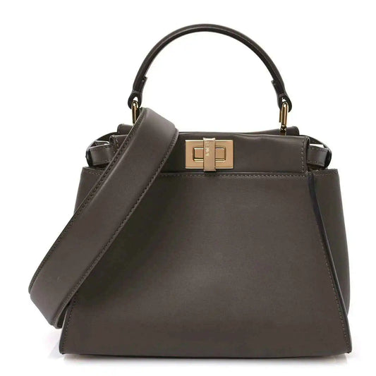 Mini Peekaboo satchel in dark chocolate brown leather, gold clasp and top handles.