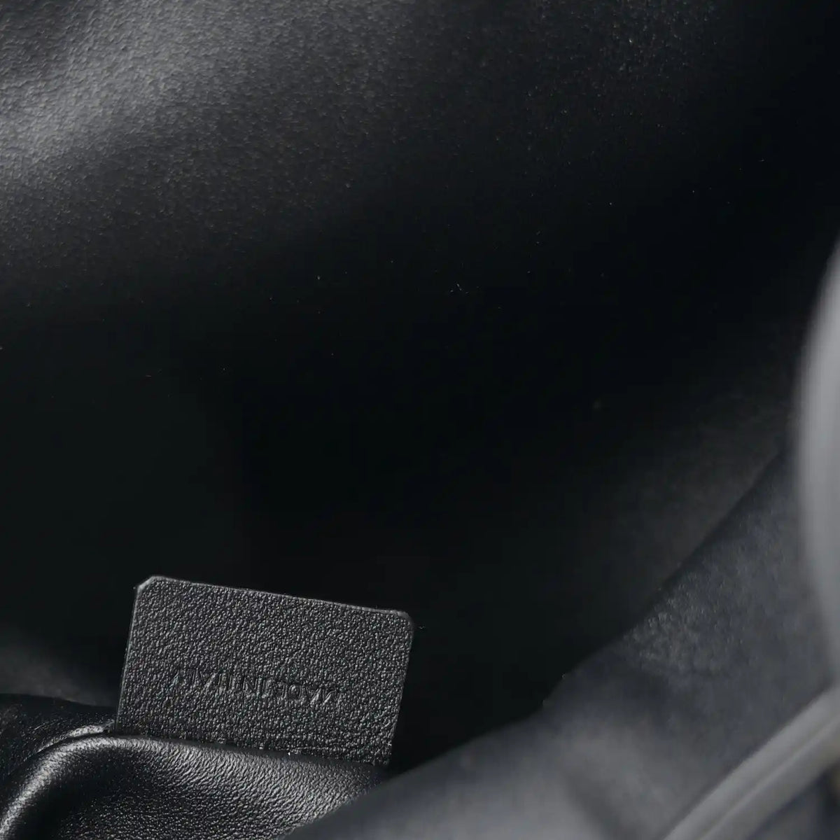 Celine calfskin Bonnie backpack close-up of stitched interior label.