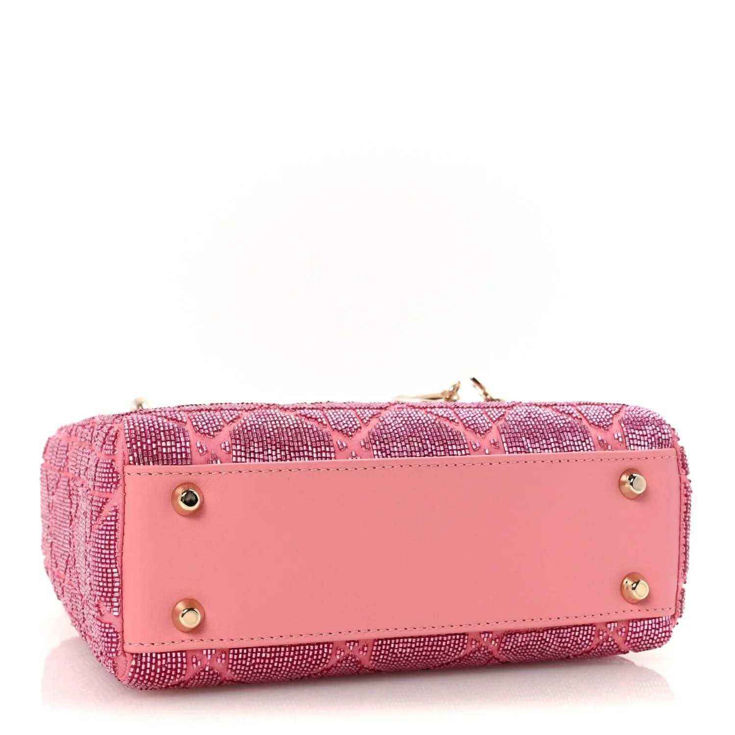 Mini Lady Dior handbag in light pink with front flap and gold button hardware