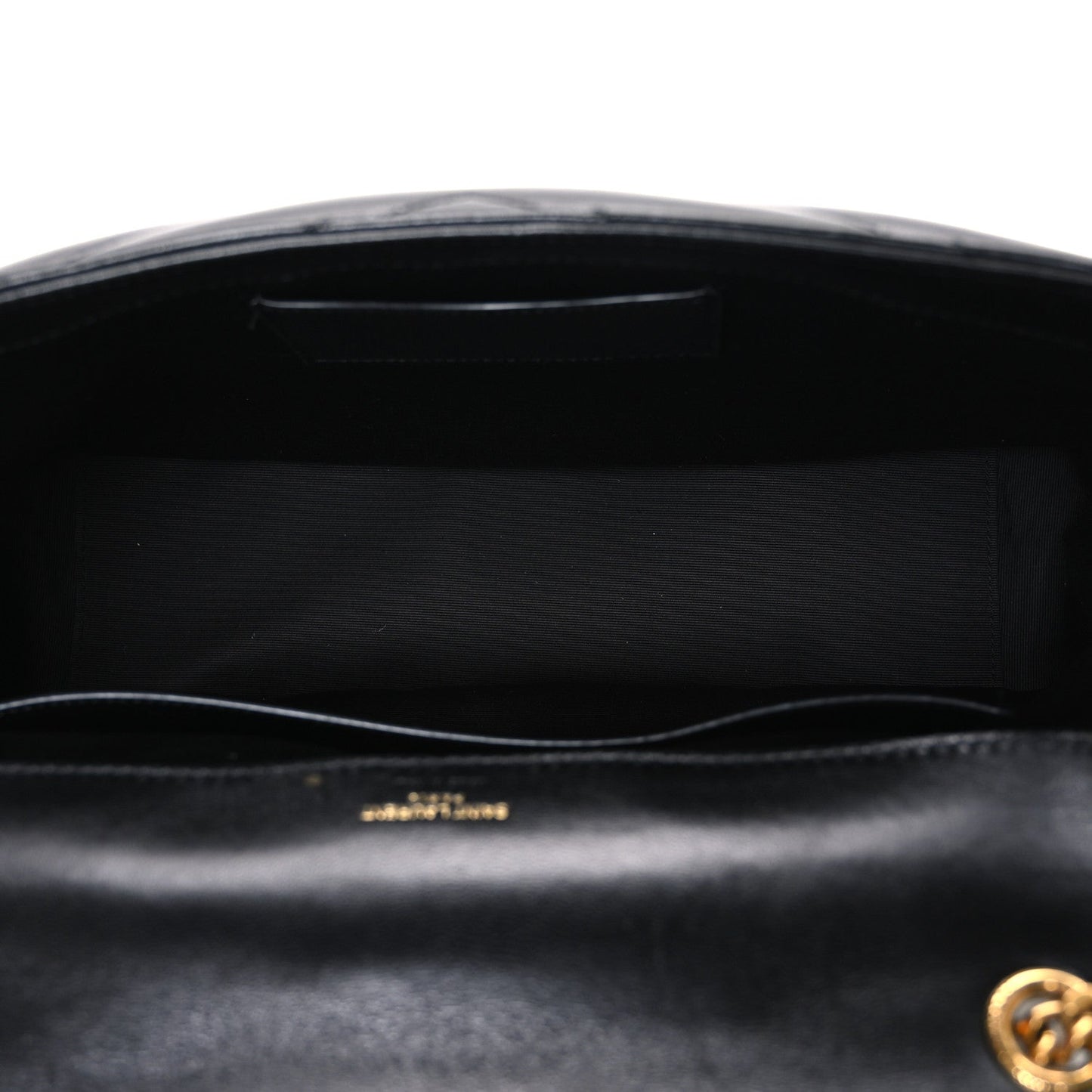 Black leather shoulder bag interior with stitched lining under open front flap