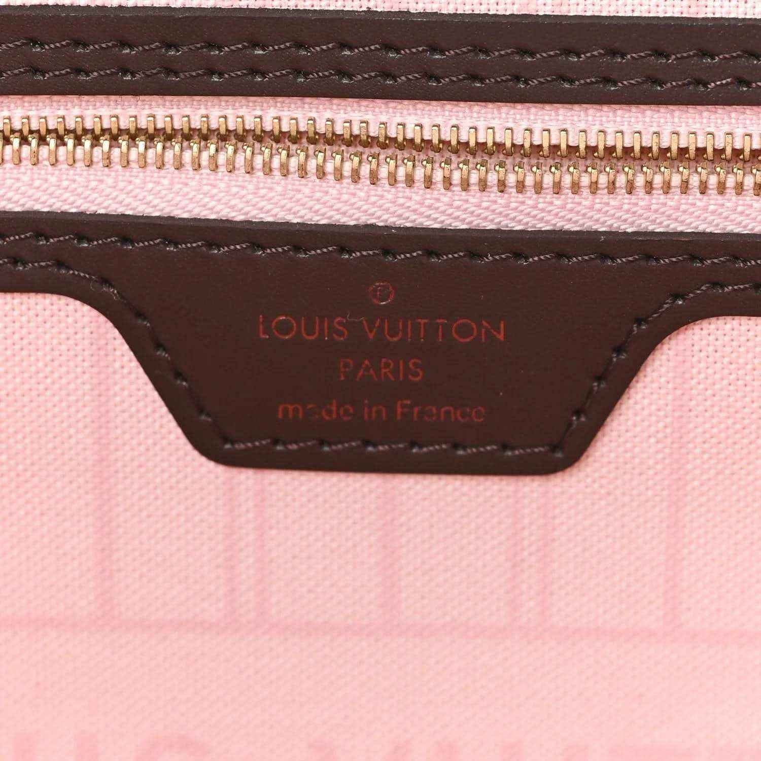 Louis Vuitton Damier Ebene tote bag interior label with stitched trim and zipper edge