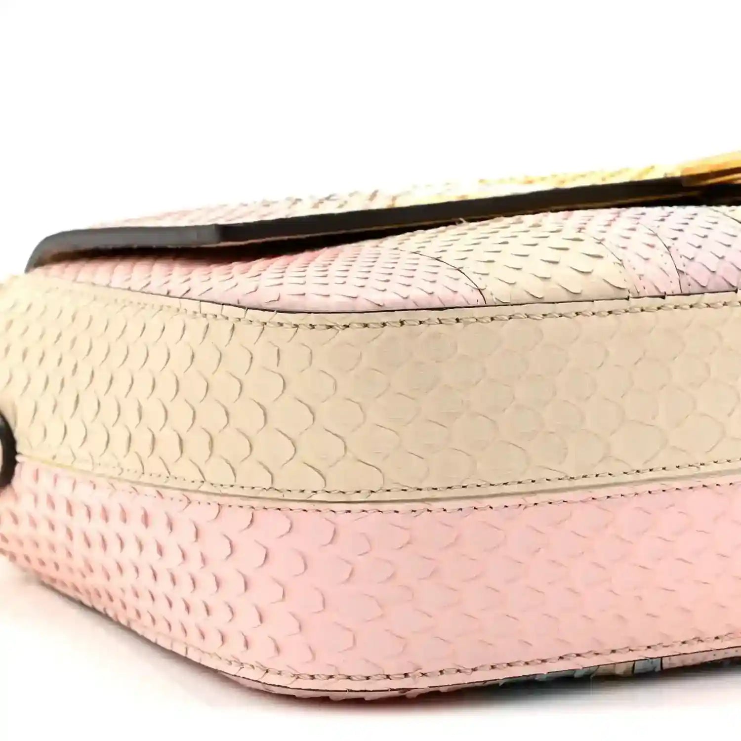 Fendi baguette handbag close-up of textured side in beige and pink scales