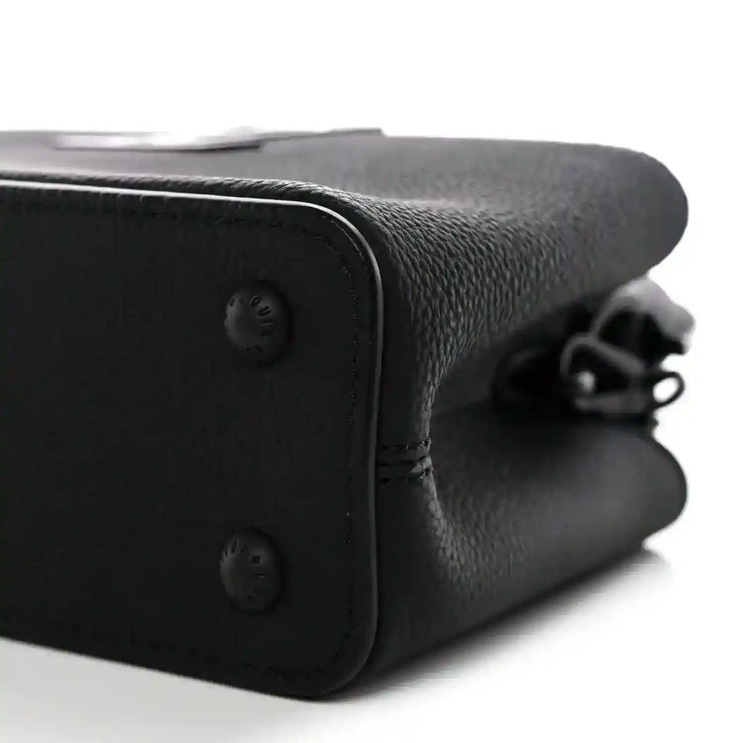 Black leather mini handbag corner with snap closure and chain strap