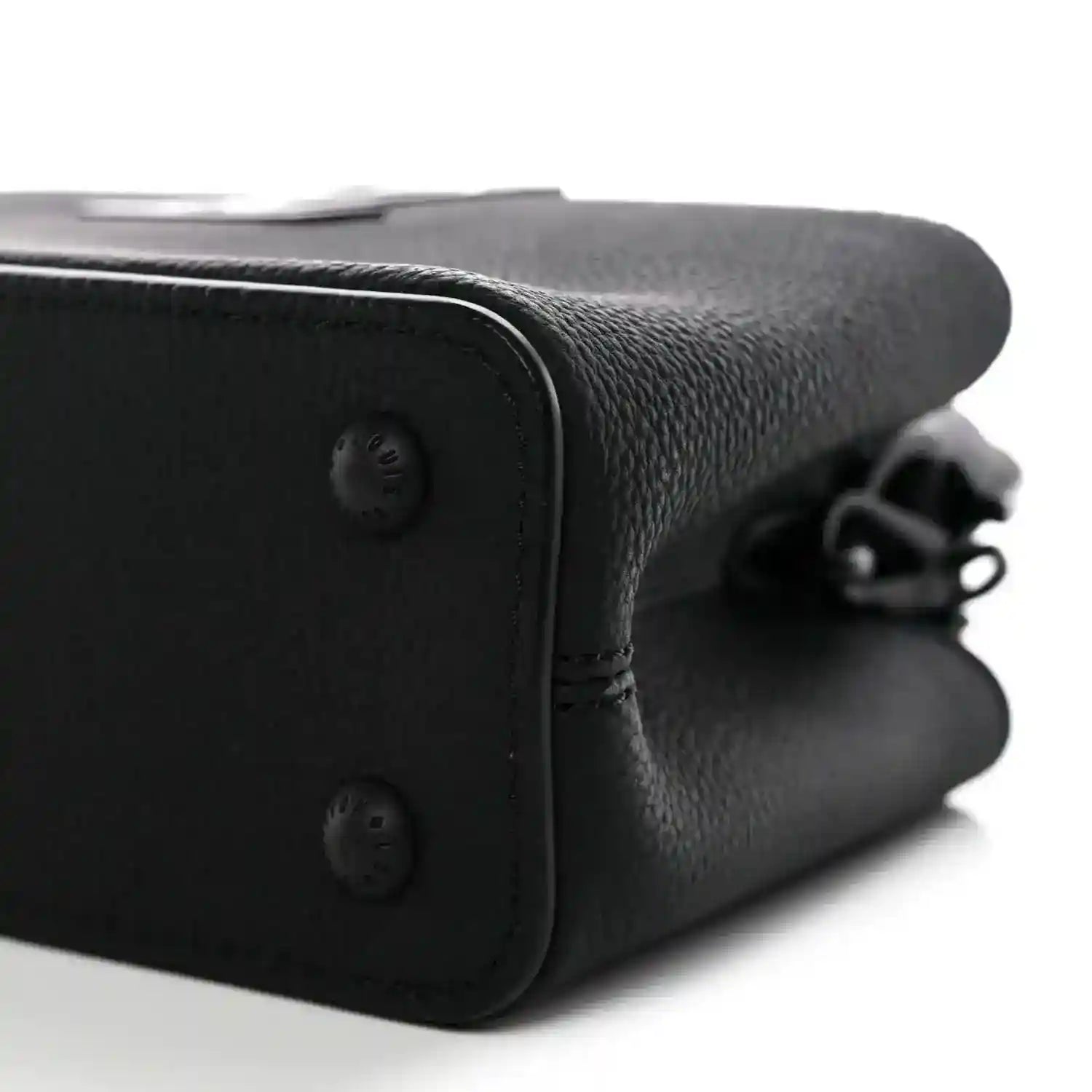 Black leather mini handbag corner with snap closure and chain strap