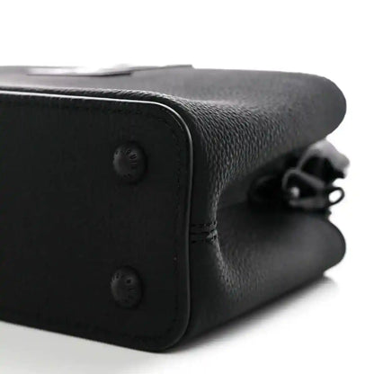 Black leather mini handbag corner with snap closure and chain strap