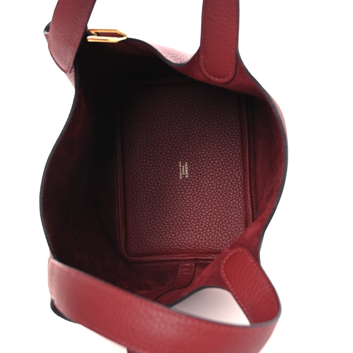 Burgundy grained leather interior with top opening and leather shoulder strap