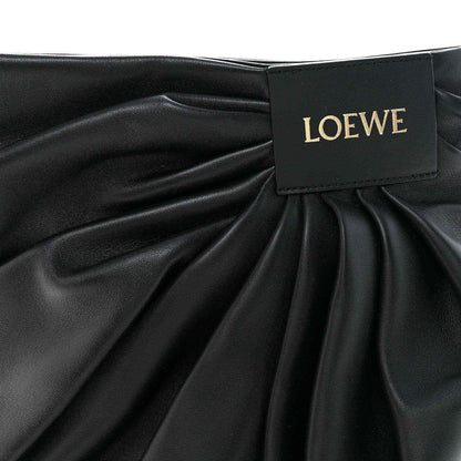 Black leather draped front with LOEWE label at gathered opening
