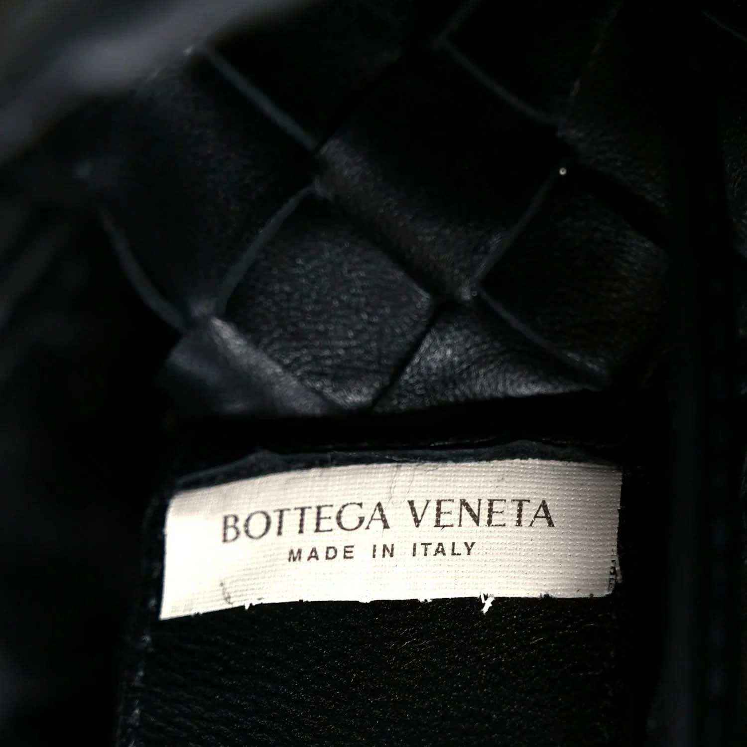 Bottega Veneta leather bag label reading “MADE IN ITALY”
