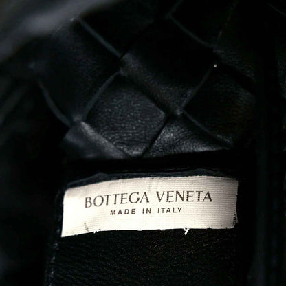 Bottega Veneta leather bag label reading “MADE IN ITALY”