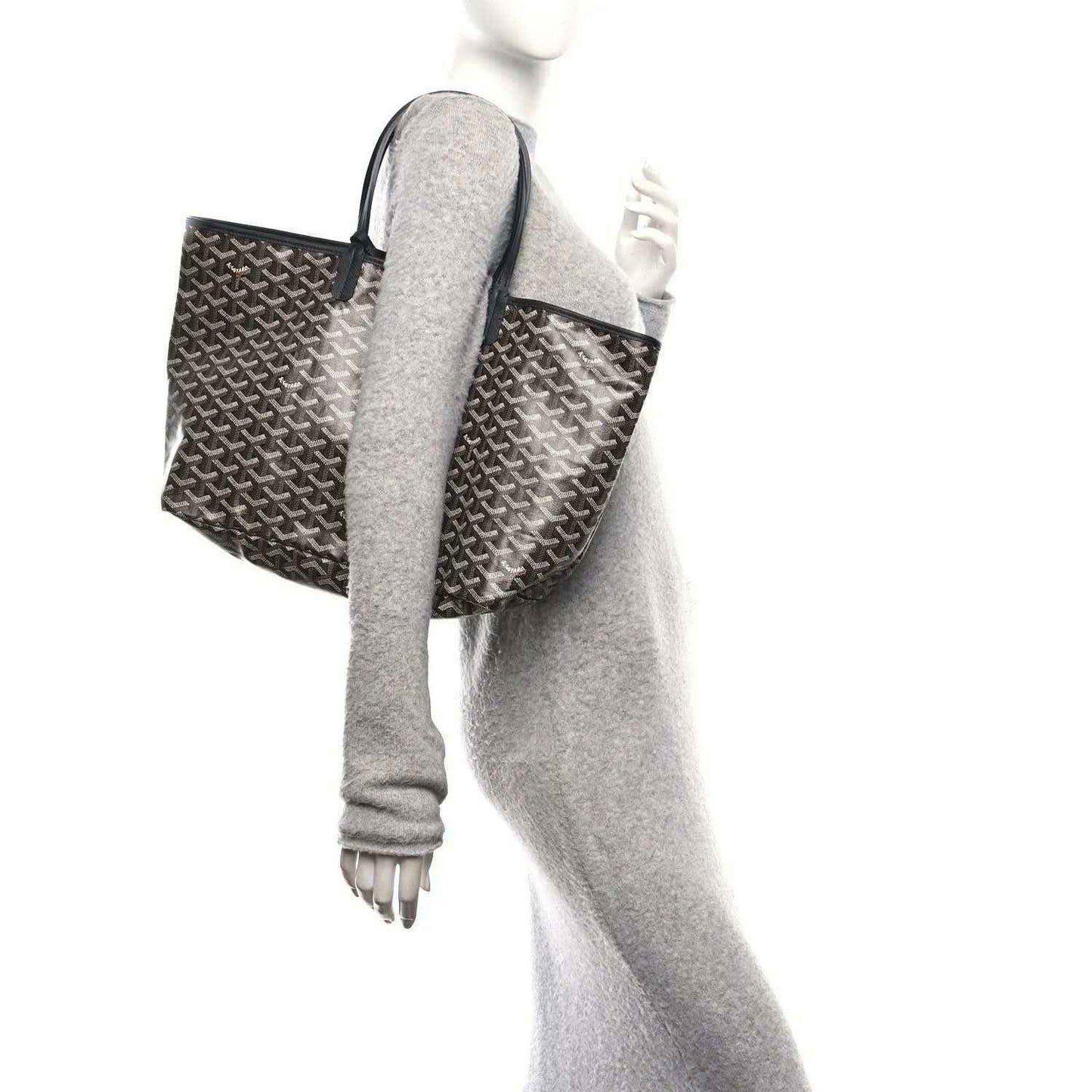 Goyardine Saint Louis PM tote held by side handles in classic black monogram pattern