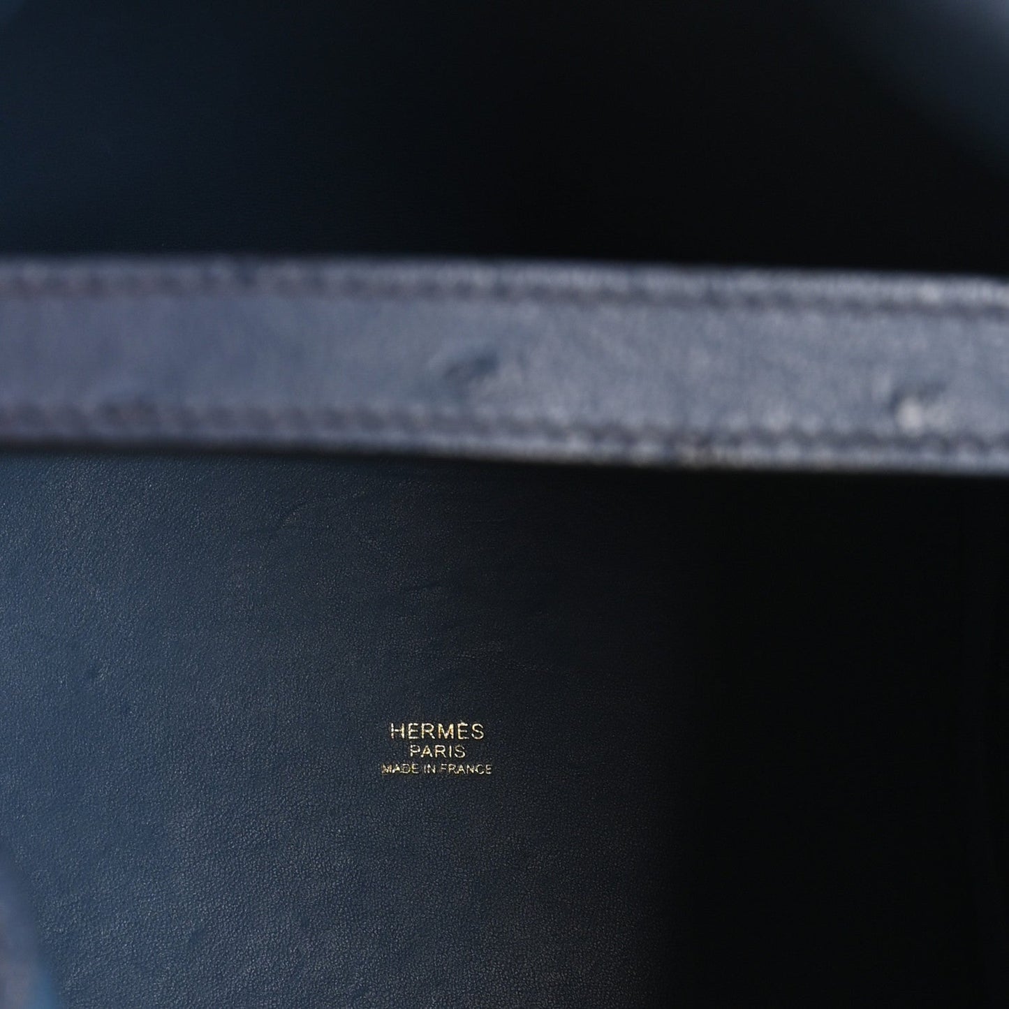 Blue leather interior with stamp reading HERMES PARIS MADE IN FRANCE.