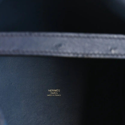 Blue leather interior with stamp reading HERMES PARIS MADE IN FRANCE.
