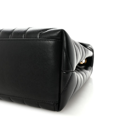 Black quilted satchel end with gold-toned chain hardware.