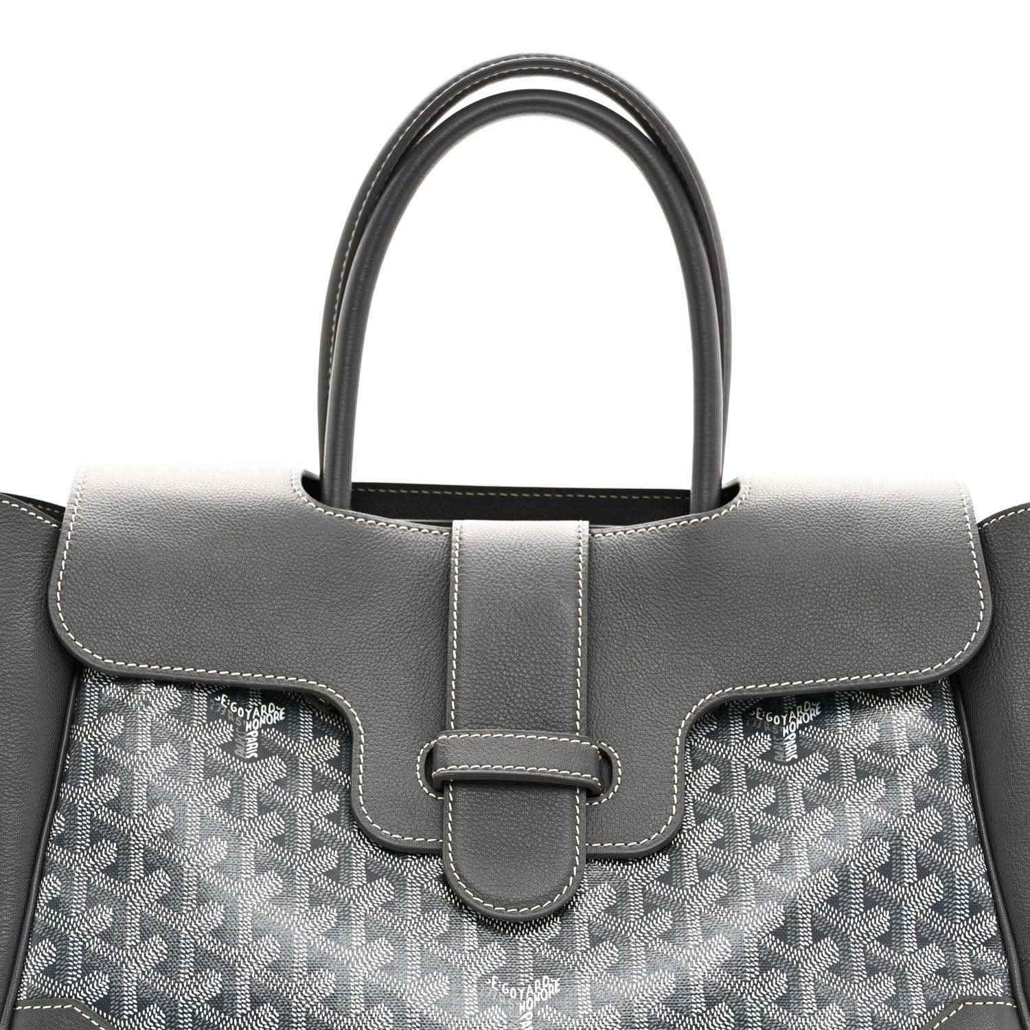 Grey Goyard tote front with leather handle, buckled strap detail and patterned canvas